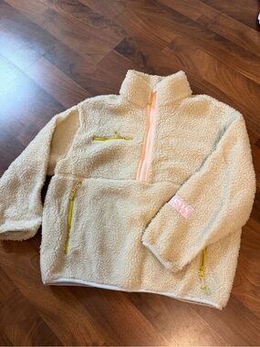 Levi's Cream Sherpa Jacket with Pink Trim and Yellow Zipper Accents
